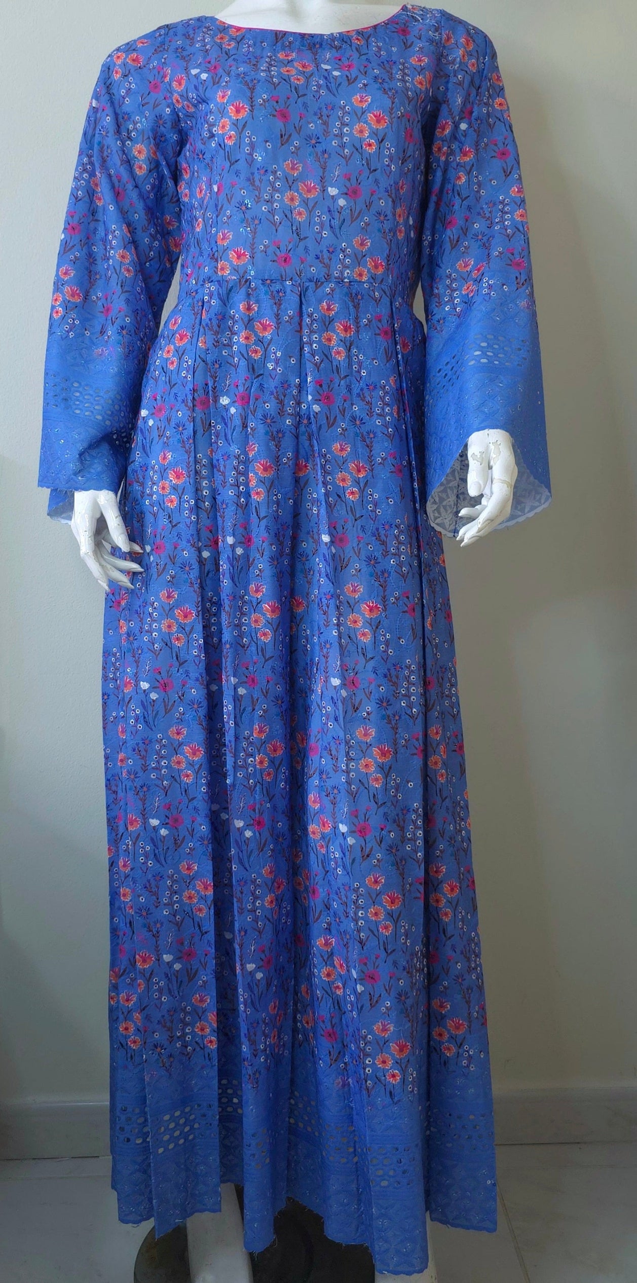 maxi dress in dark dusk blue with a floral pattern. Chikan kari design at the bottom of dress.