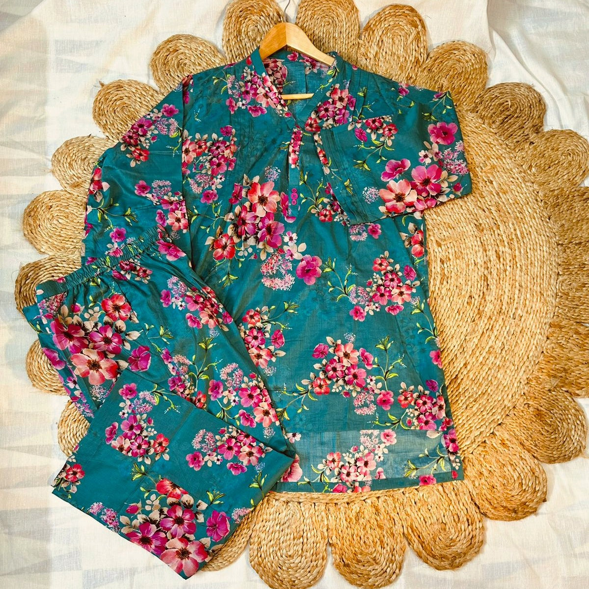 A teal floral two-piece Pakistani Suit, perfect for summer, Frontside.