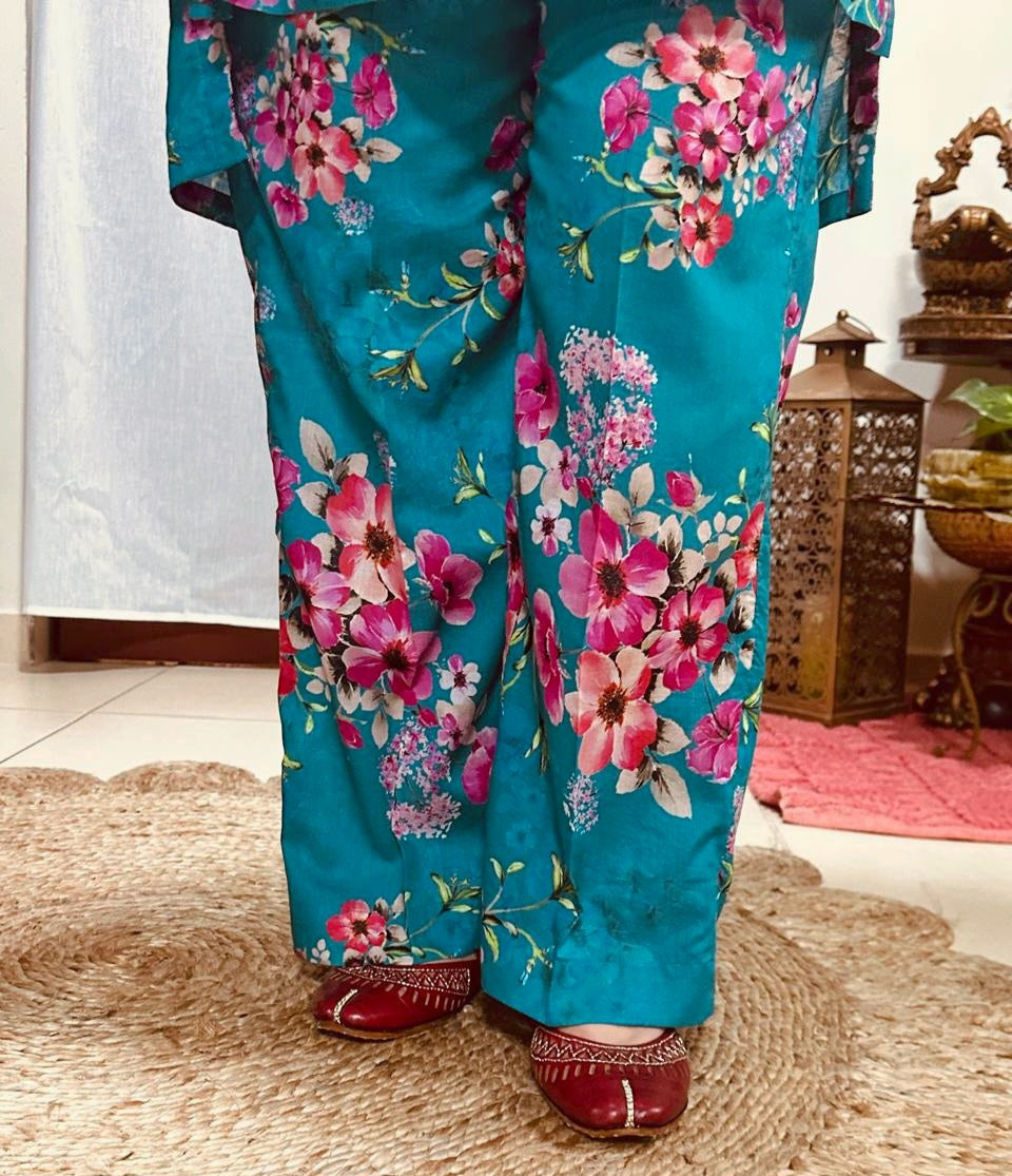 A teal floral two-piece Pakistani Suit, perfect for summer, Trousers.