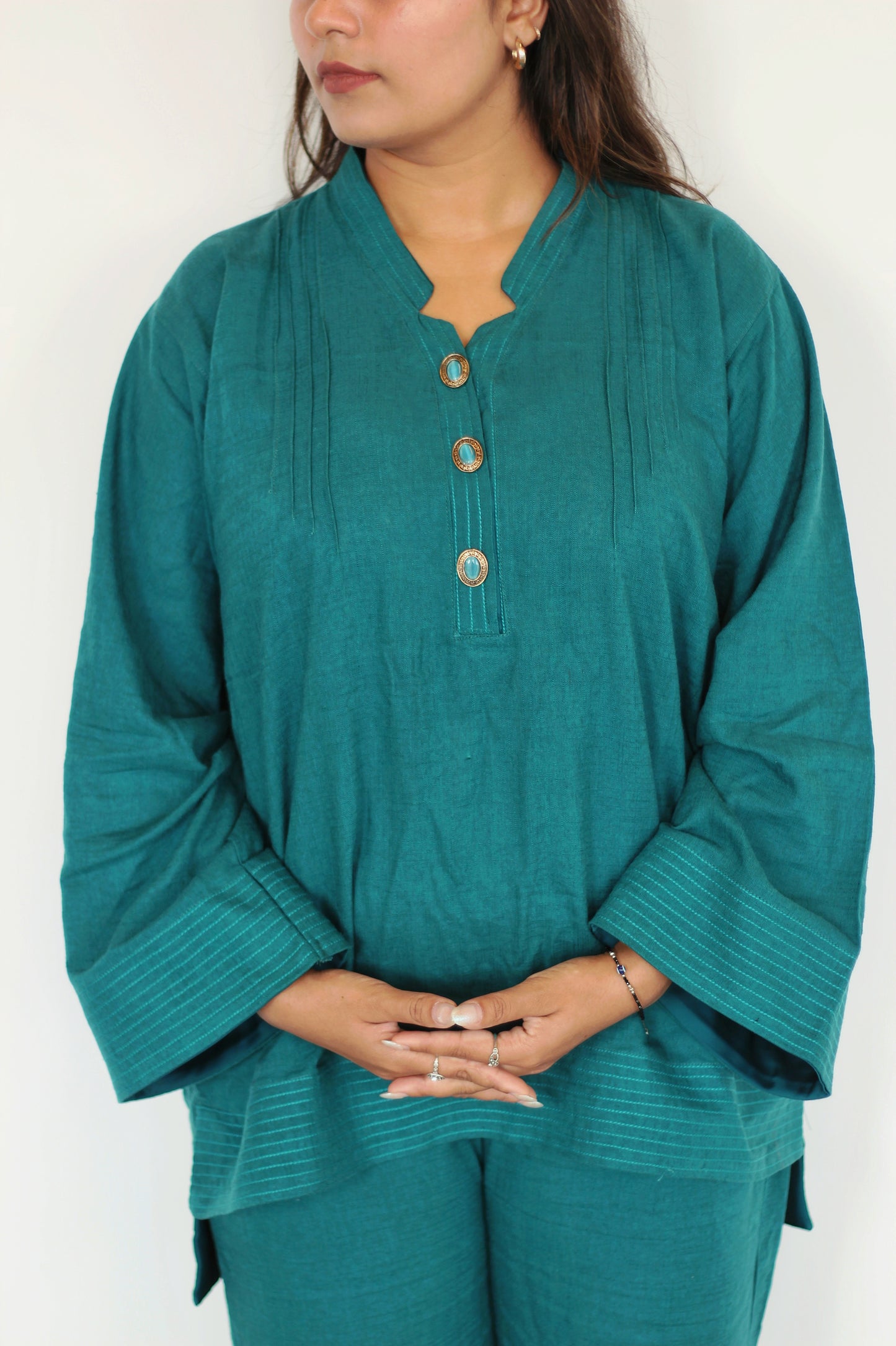 Teal linen top Pakistani Suit with turquoise gem buttons, close-up. Warm and comfortable, perfect for fall and winter.