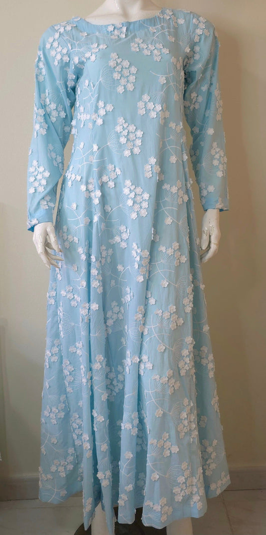 light blue maxi dress with white flower embroidery all over.