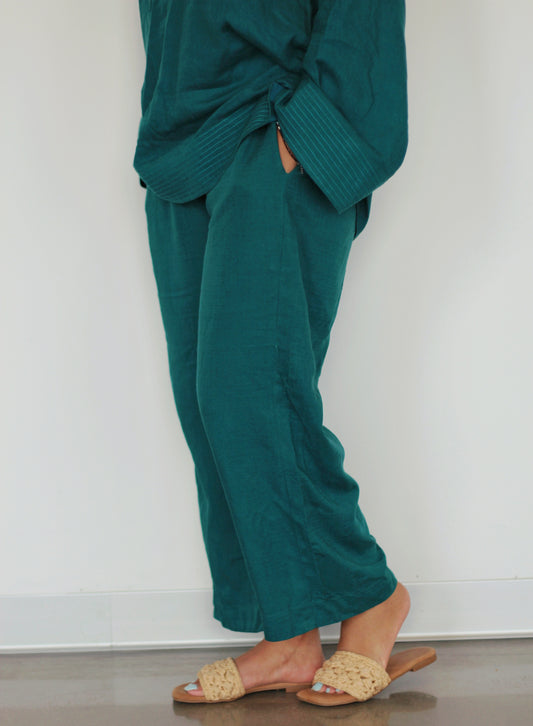 Teal linen pants from our Teal Pakistani Suit, perfect for fall and winter. Comfortable and stylish, these pants complement our Teal Top. The full-length design and relaxed fit offer a sophisticated look.